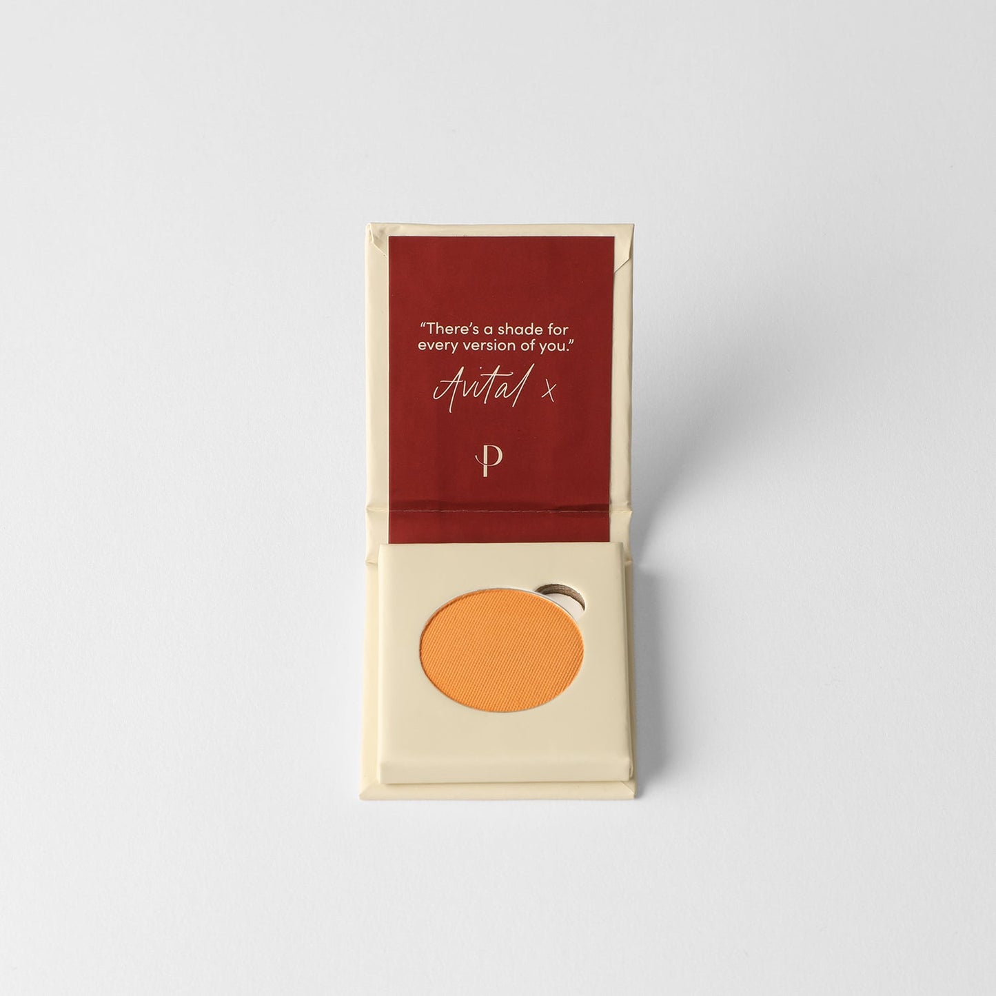 Open compact with Matte Pressed Eyeshadow featuring rich vegan pigment in orange hue, positioned on white background, "Avital" signature visible.