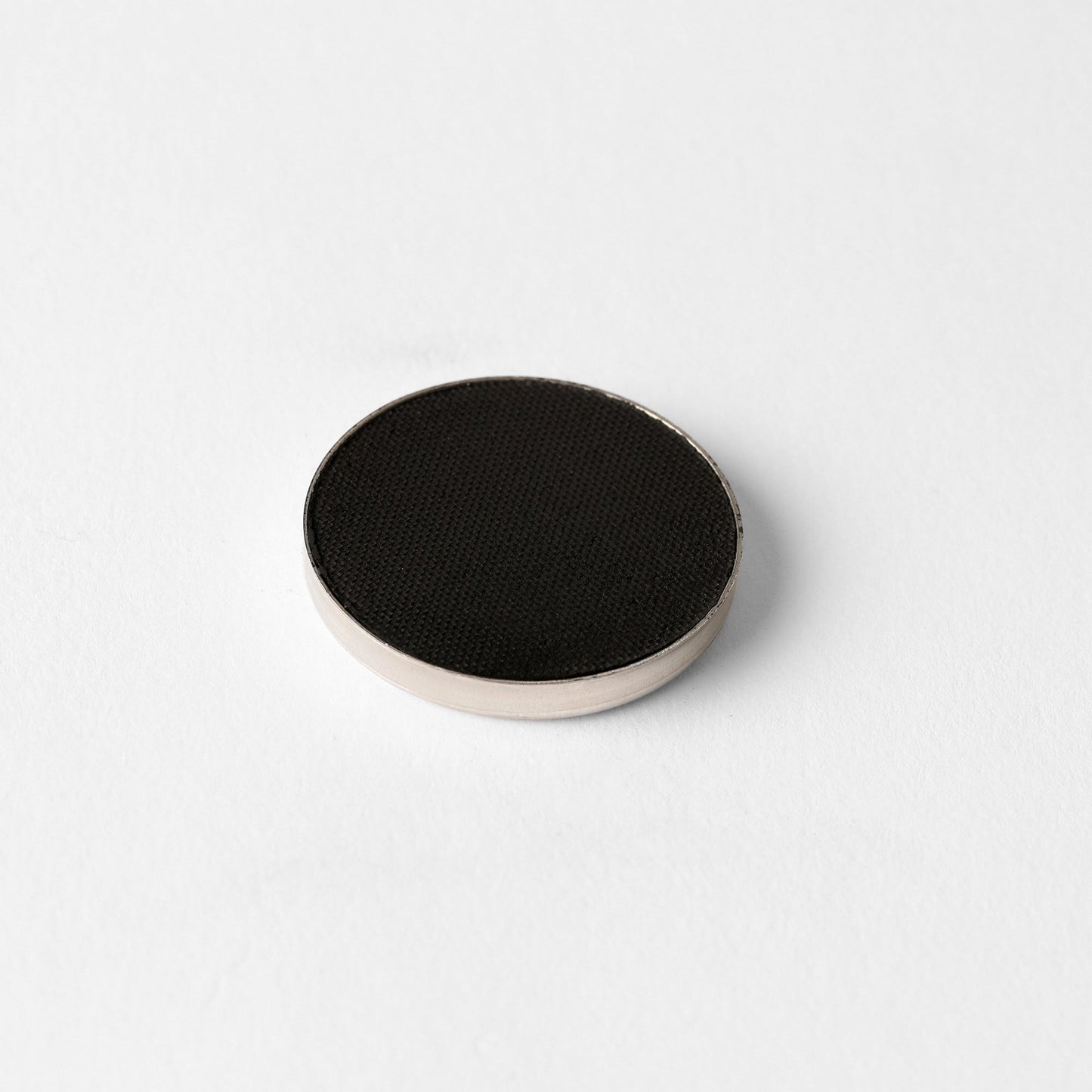 Matte Pressed Eyeshadow in single circular pan, ideal for creating smooth, blendable looks. Versatile for natural or defined finishes.