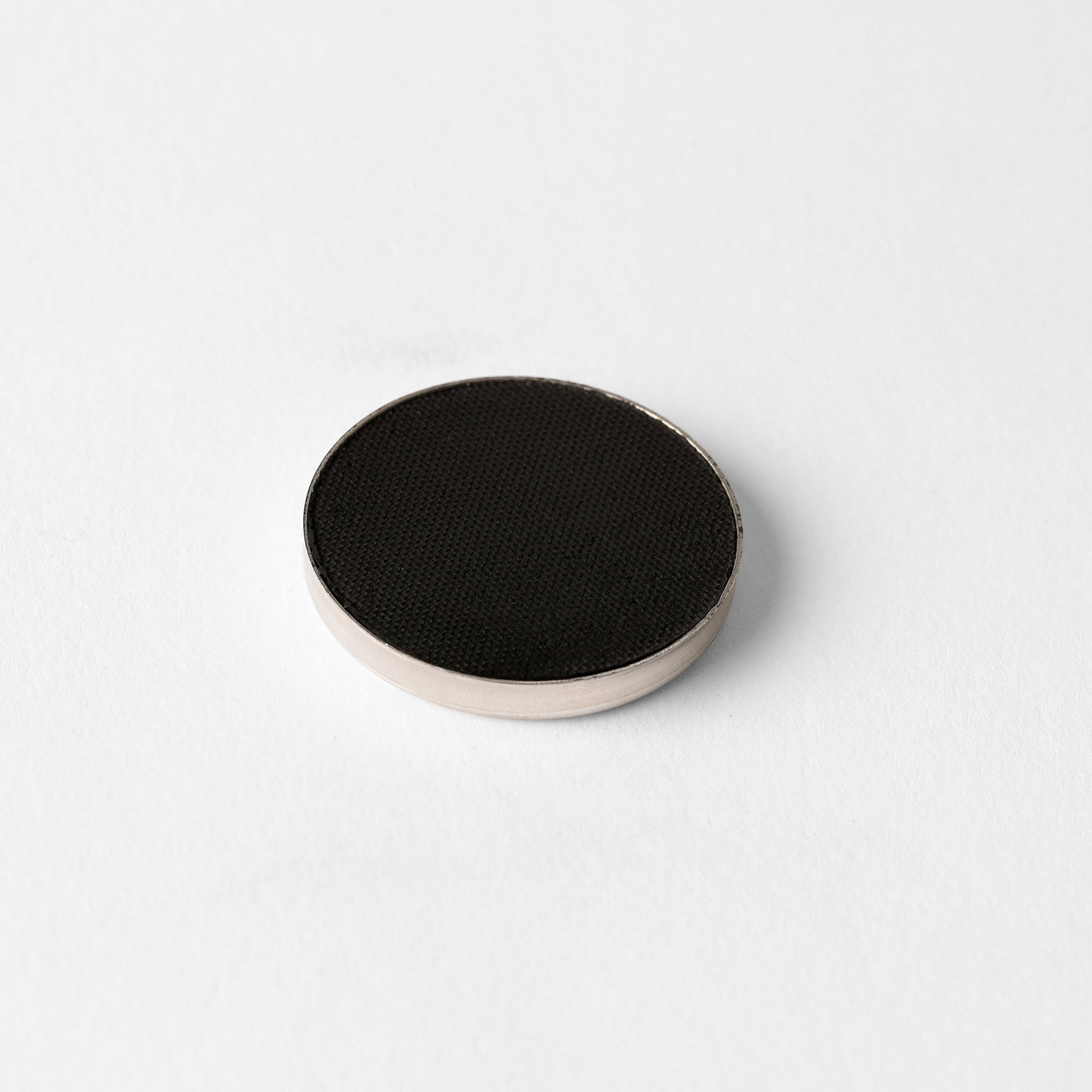 Matte Pressed Eyeshadow in single circular pan, ideal for creating smooth, blendable looks. Versatile for natural or defined finishes.
