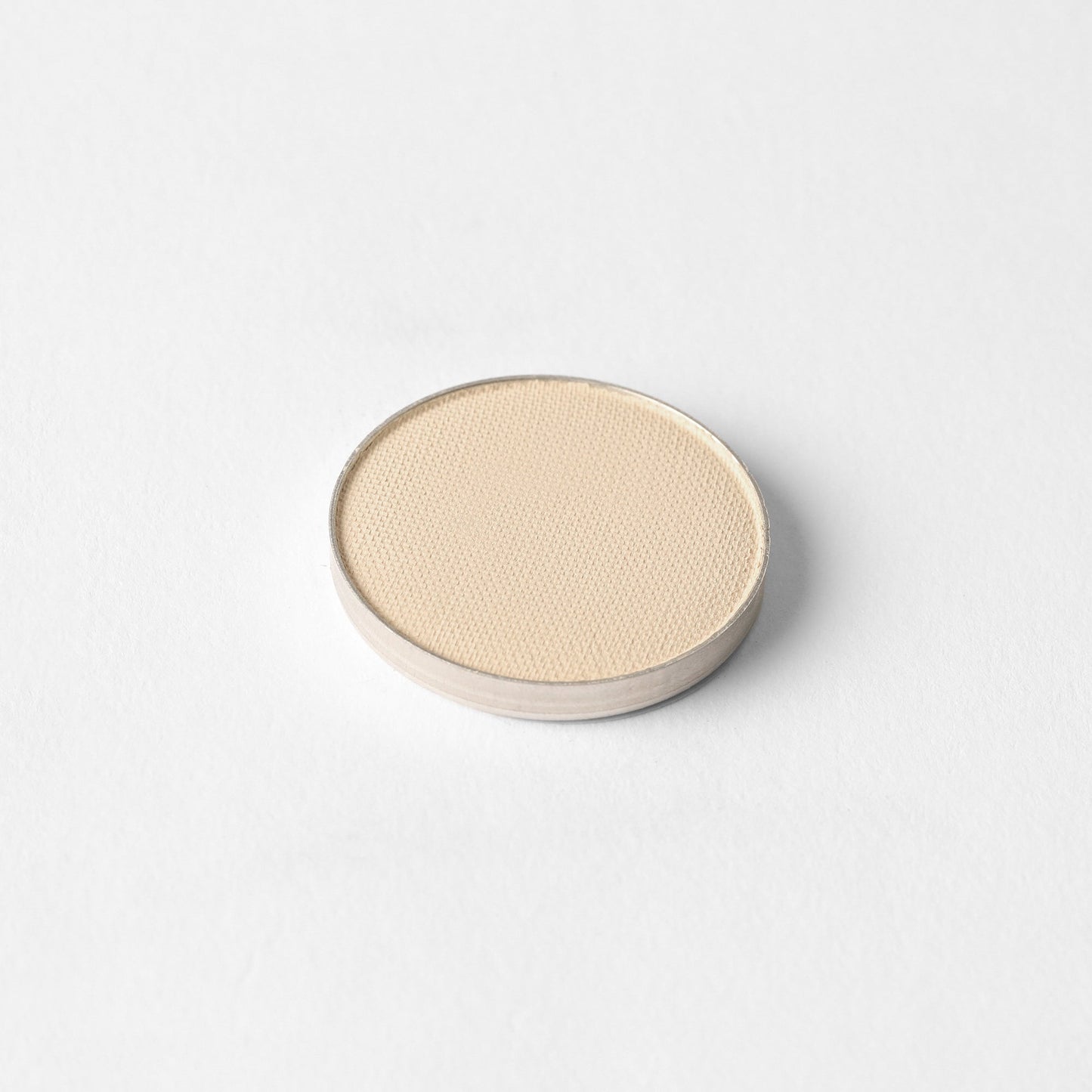 Matte Pressed Eyeshadow single pan on a white background, showcasing smooth and vegan pigments for a versatile makeup finish.