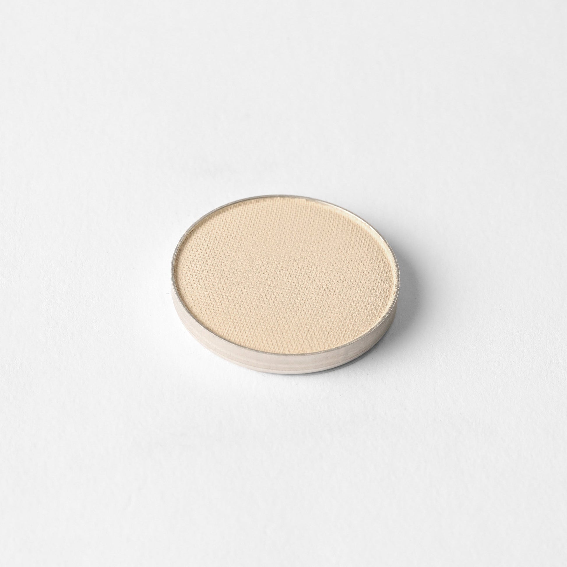 Matte Pressed Eyeshadow single pan on a white background, showcasing smooth and vegan pigments for a versatile makeup finish.