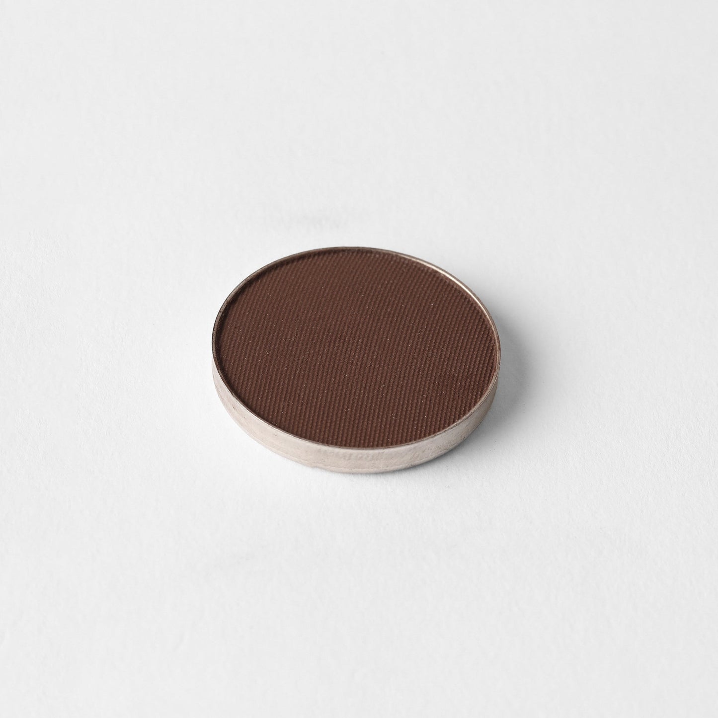 Matte Pressed Eyeshadow in rich brown tone, smooth and vegan, perfect for blending and layering, fits magnetic palettes.