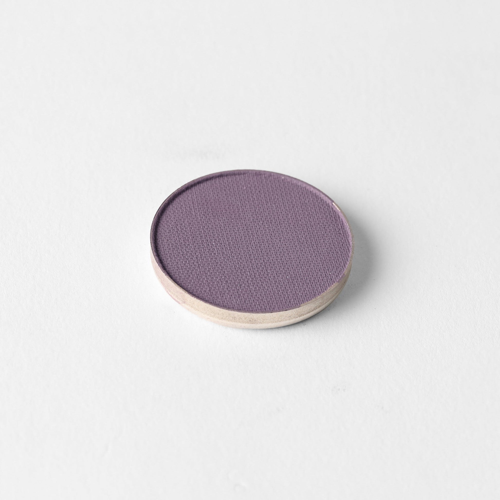 Matte Pressed Eyeshadow in purple shade on a white background