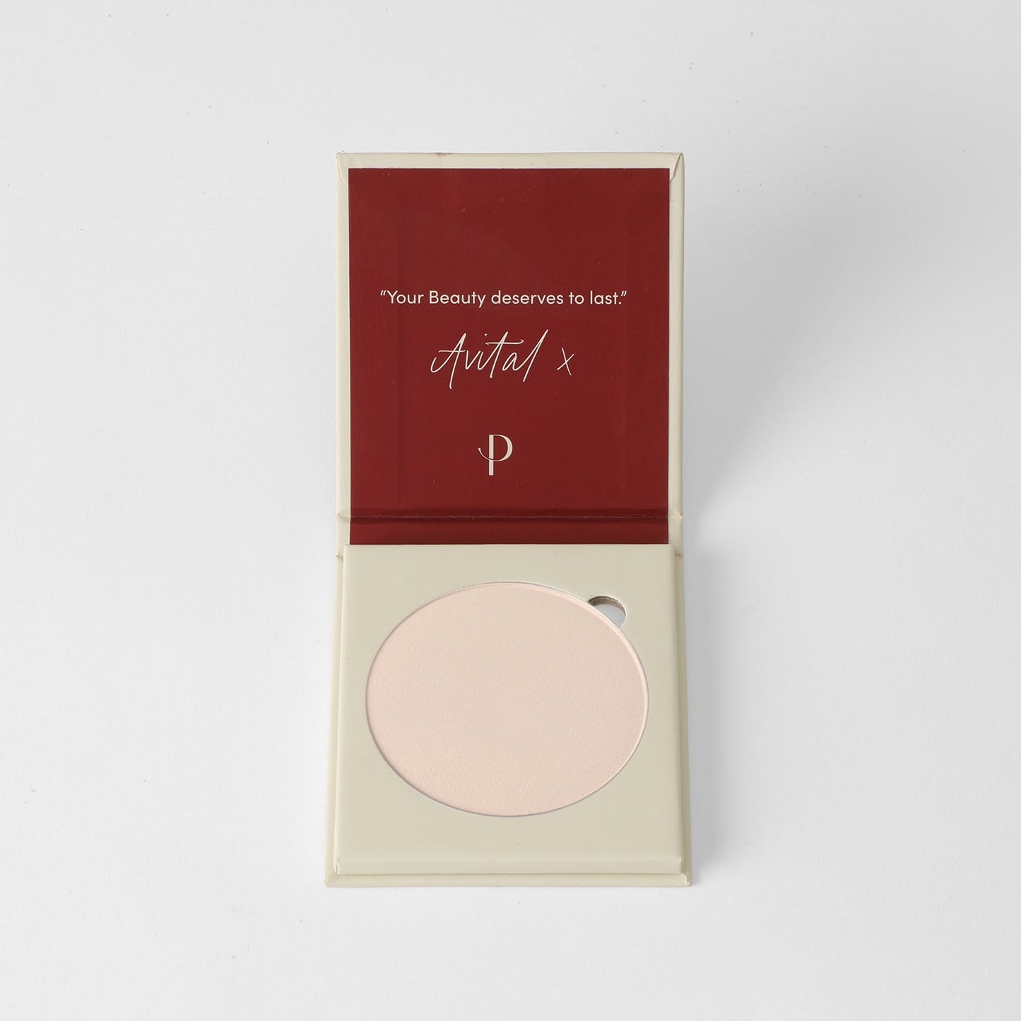 Face Powder in compact case, vegan pressed and lightweight for long-lasting coverage, fits Magnetic Palette, over ivory background.