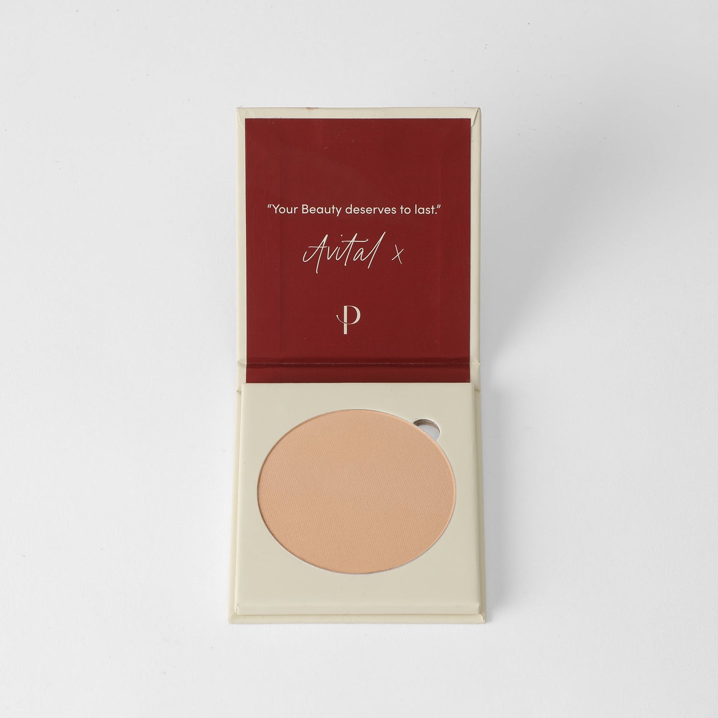 Face Powder - vegan pressed powder in an open compact case with a smooth finish, ideal for long-lasting coverage.