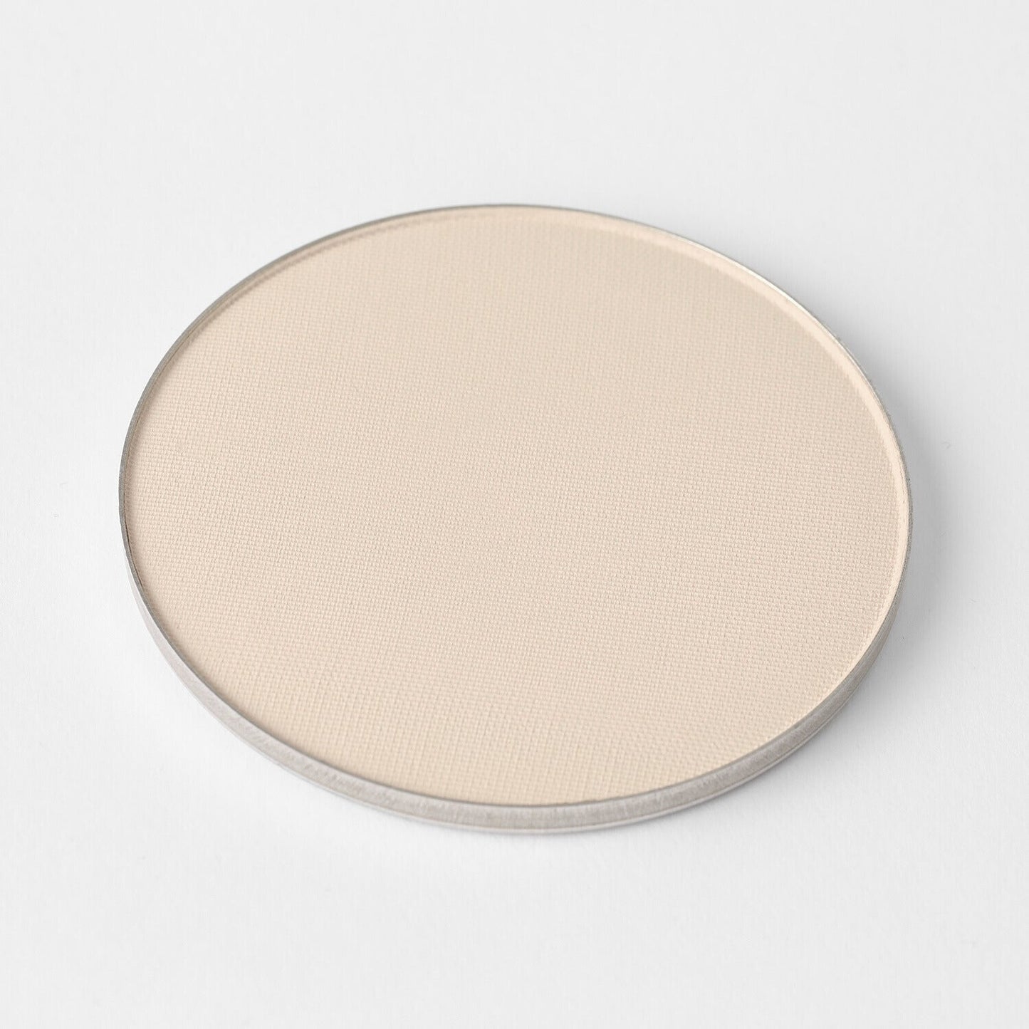 Lightweight vegan Face Powder in a circular pan, perfect for long-lasting coverage and seamless use with magnetic palettes.