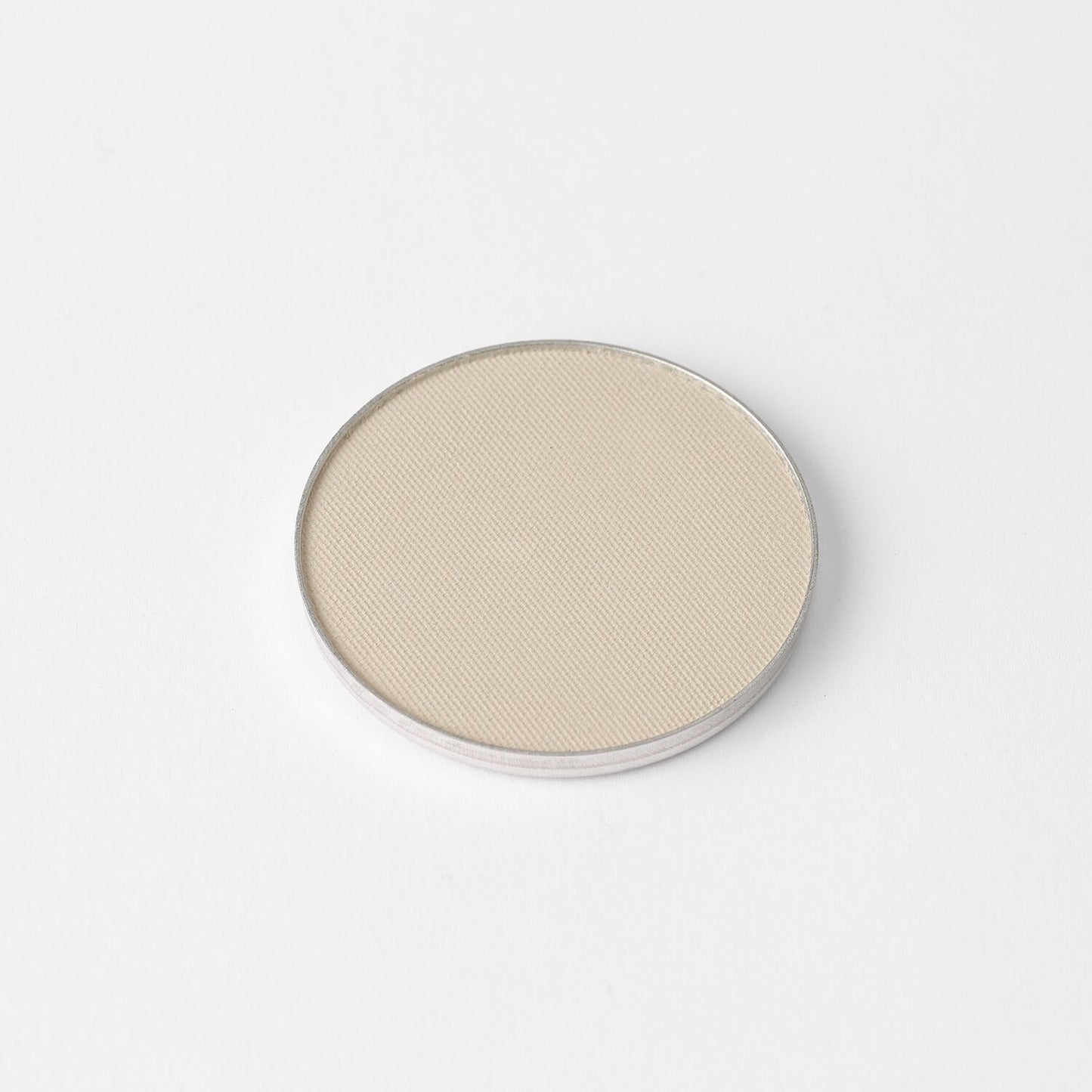 Lightweight vegan highlighter in pan form, perfect for customizable palettes, offering glow or matte finish for radiant shine.