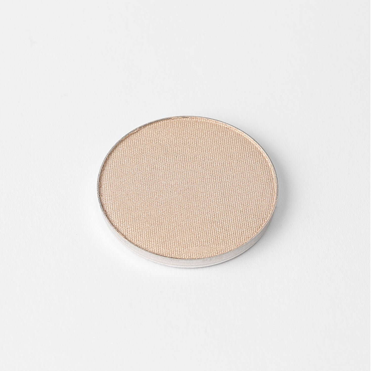 Highlighter in a round pan with vegan formula, available in glow and matte finishes, designed for a radiant and customizable beauty look.