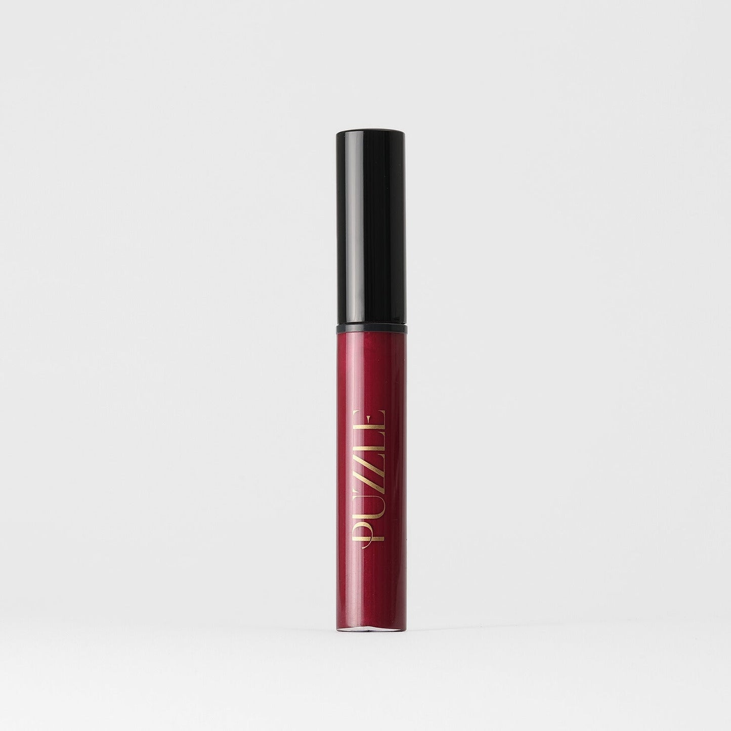 Lip Gloss Wand in sleek red tube for a soft-touch, high-shine finish enhancing lip nourishment and smoothness.