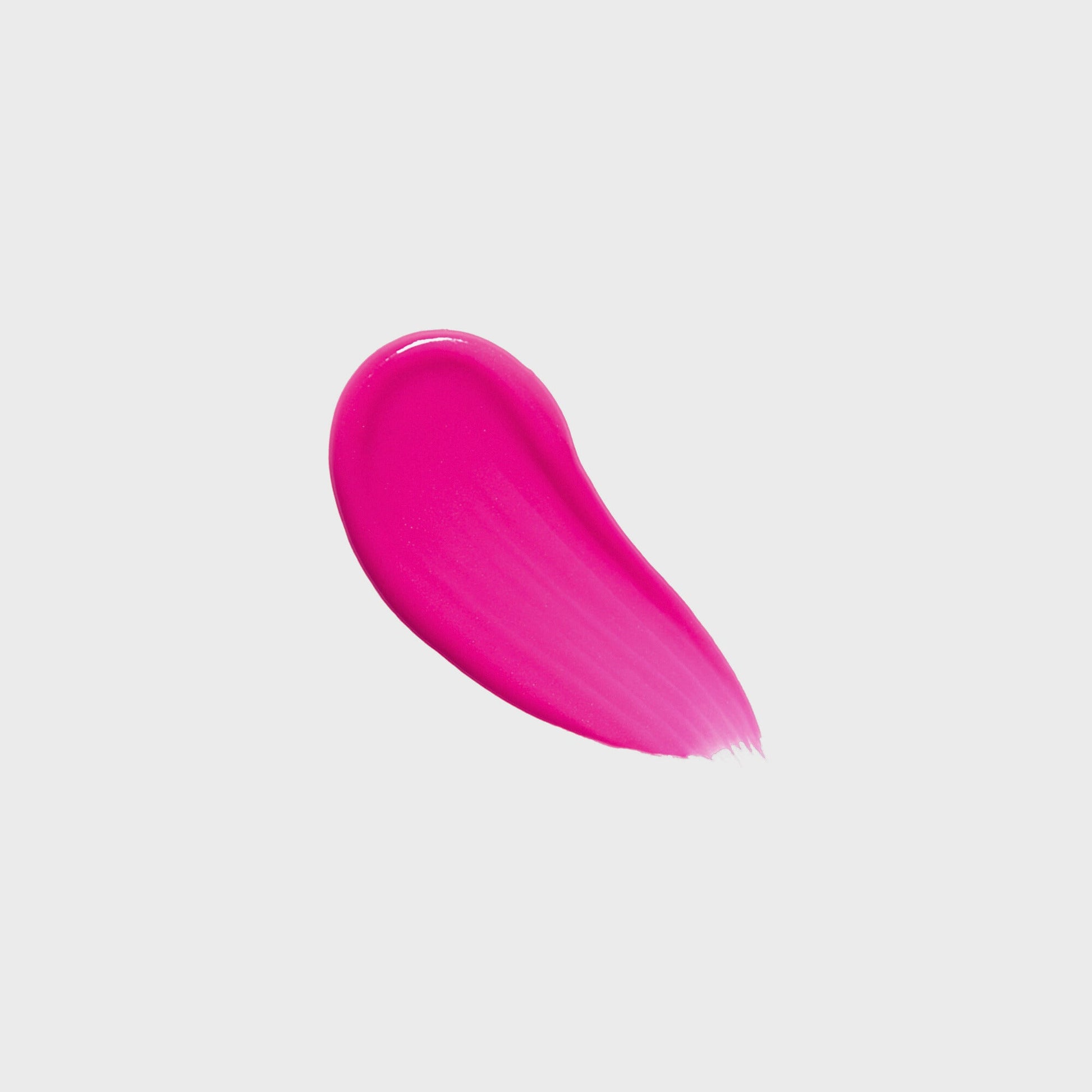 Close-up of vibrant pink Lip Gloss Wand swatch showing high-shine, vegan formula with nourishing glow.