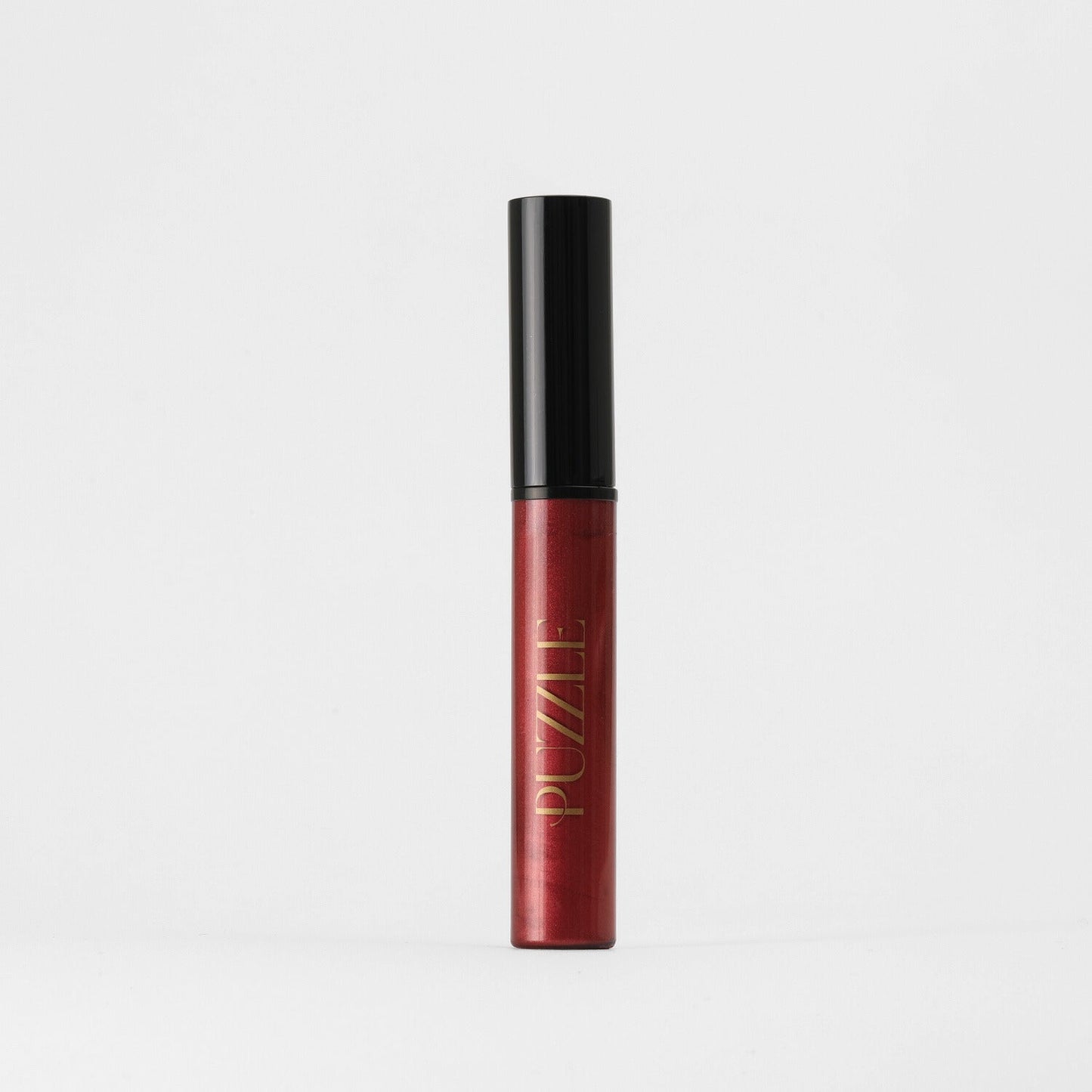Lip Gloss Wand in red for a high-shine, vegan finish, ideal for layering or wearing alone, offering a dimensional glow.
