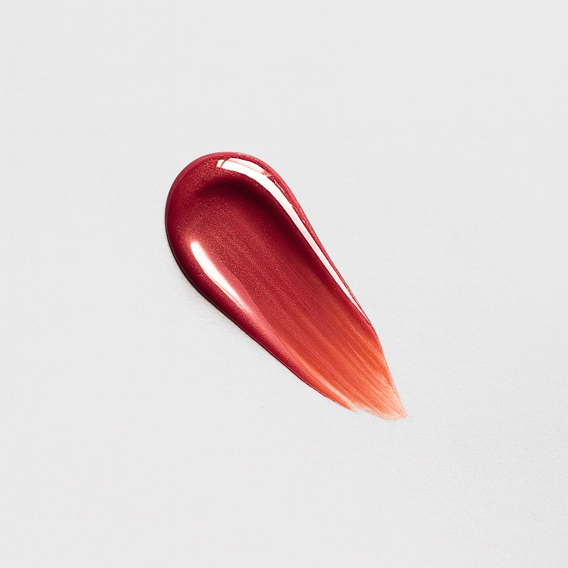 Swatch of Lip Gloss Wand showing high-shine and vibrant hue for a dimensional glow.