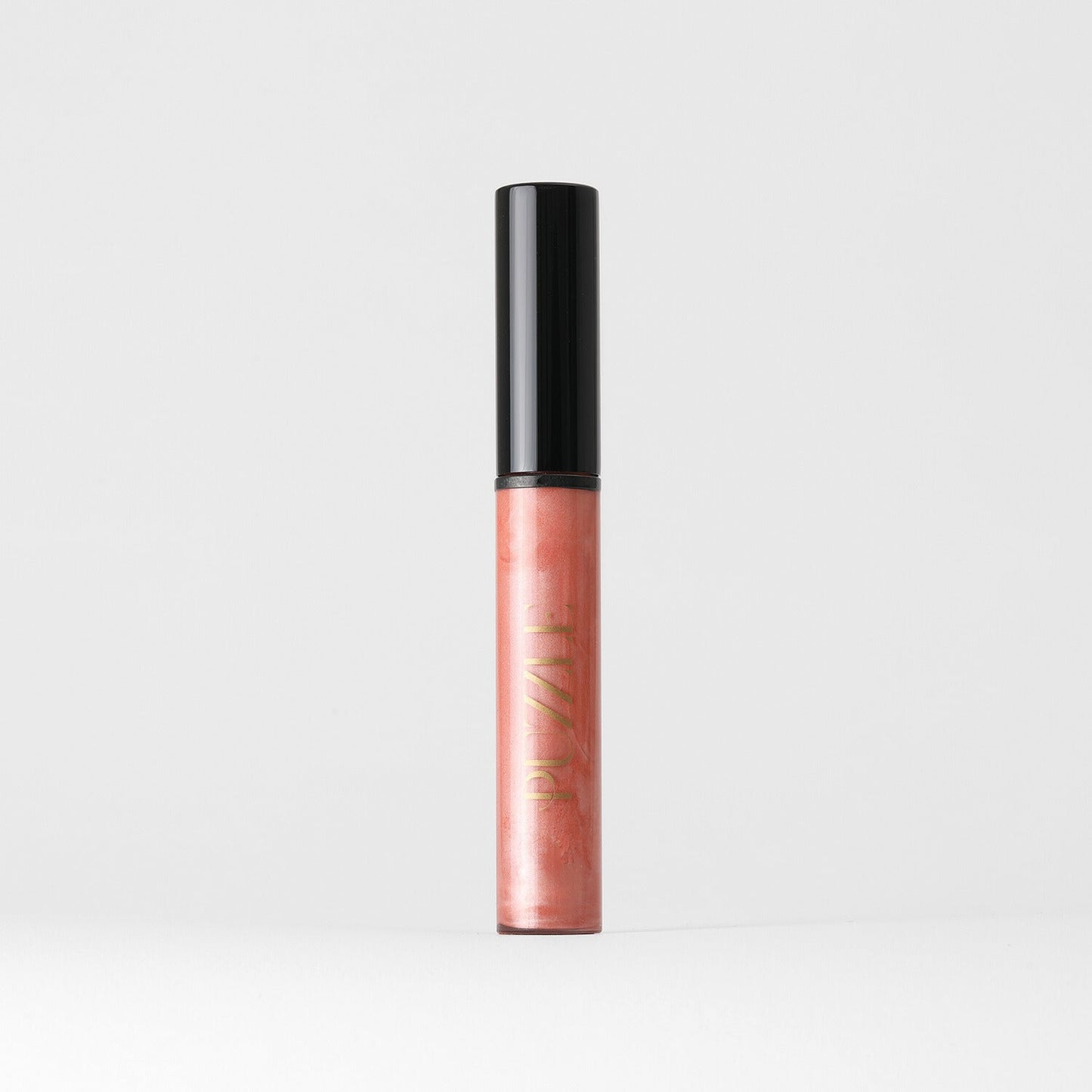 Lip Gloss Wand in elegant packaging with soft-touch high-shine finish, vegan formula for nourished, smooth lips. Wear alone or over lipstick.