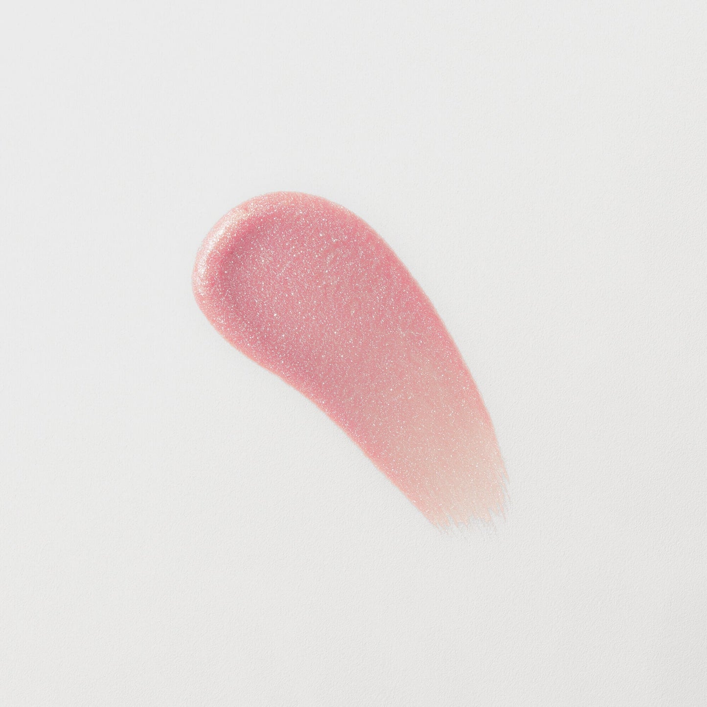 Lip Gloss Wand swatch showing soft-touch, high-shine, pink vegan formula with a smooth finish.