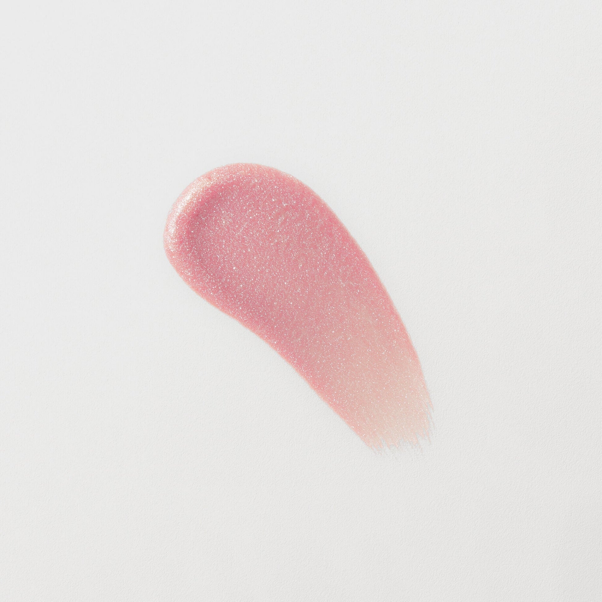 Lip Gloss Wand swatch showing soft-touch, high-shine, pink vegan formula with a smooth finish.