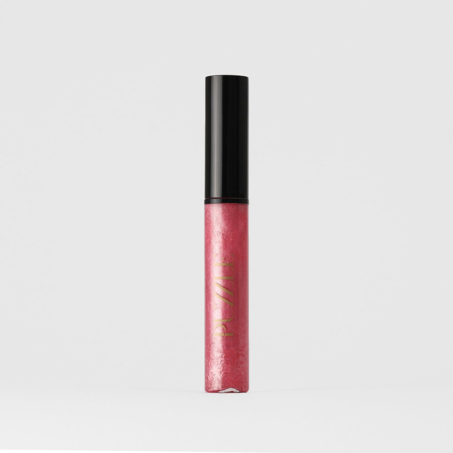 Lip Gloss Wand in pink with high-shine finish, vegan, nourishing, and non-sticky for a dimensional glow, ideal for layering with lipstick.