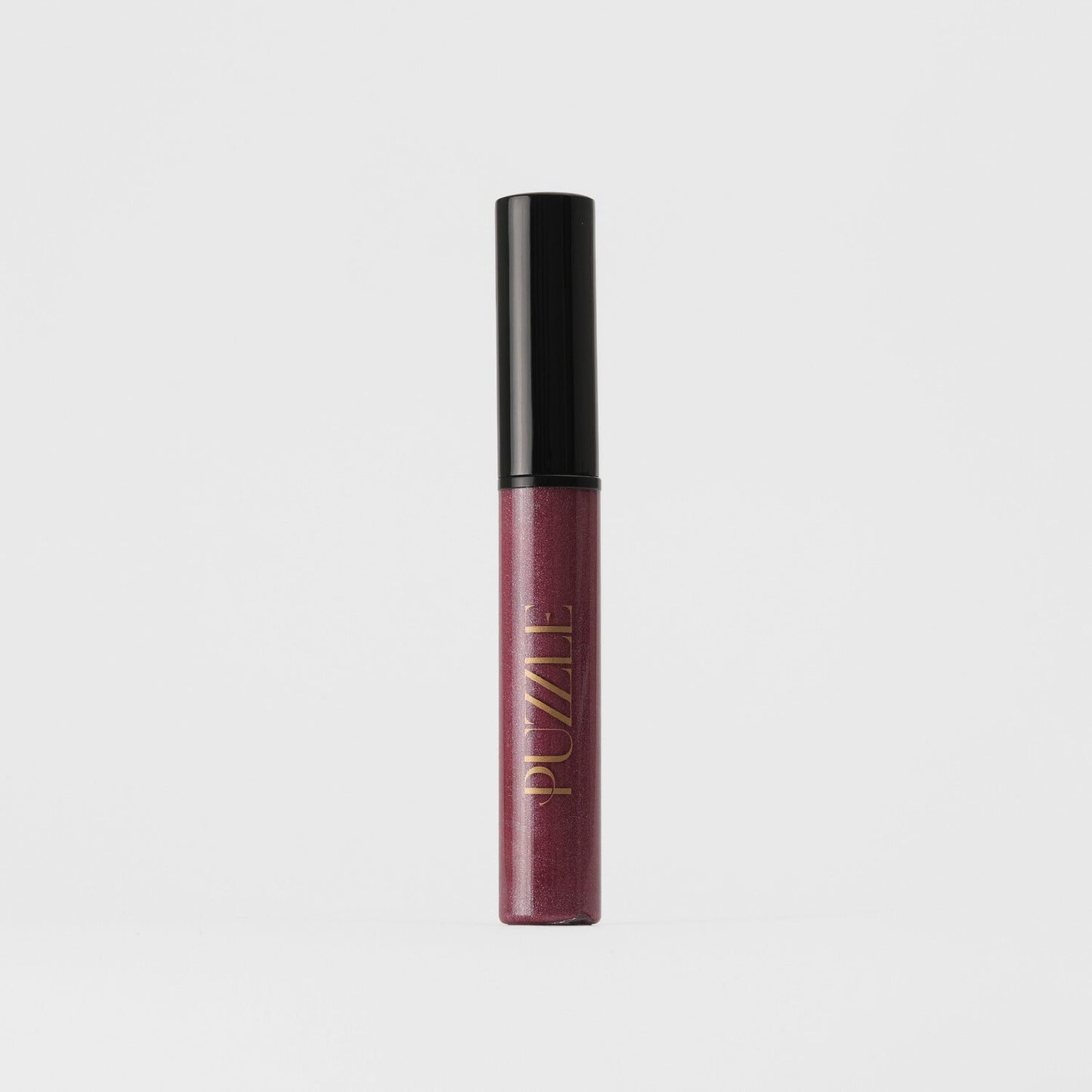 Lip Gloss Wand in a sleek tube, vegan and nourishing for a high-shine finish; ideal for layering over lipstick for a multidimensional look.