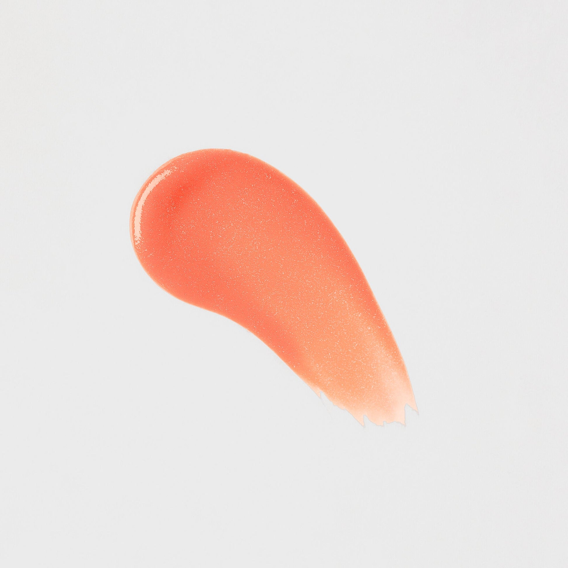 Lip Gloss Wand swatch shows soft-touch, high-shine vegan gloss adding dimensional glow, perfect for layering or standalone wear.