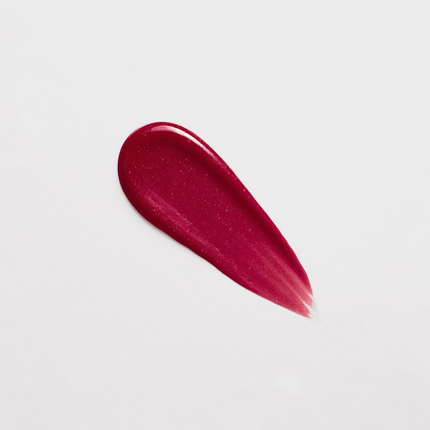 Rich pink swatch of Lip Gloss Wand showcasing high-shine, dimensional glow and smooth, nourishing texture.
