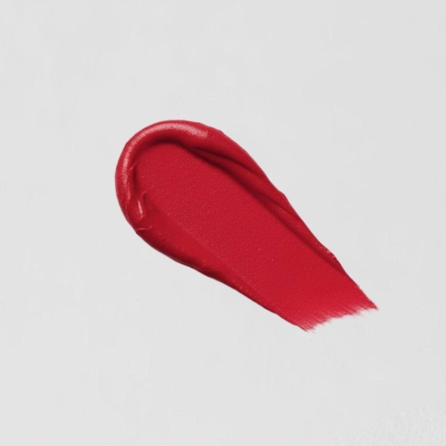 Lip Stain sample showing the rich, velvety matte finish in a vibrant red shade.
