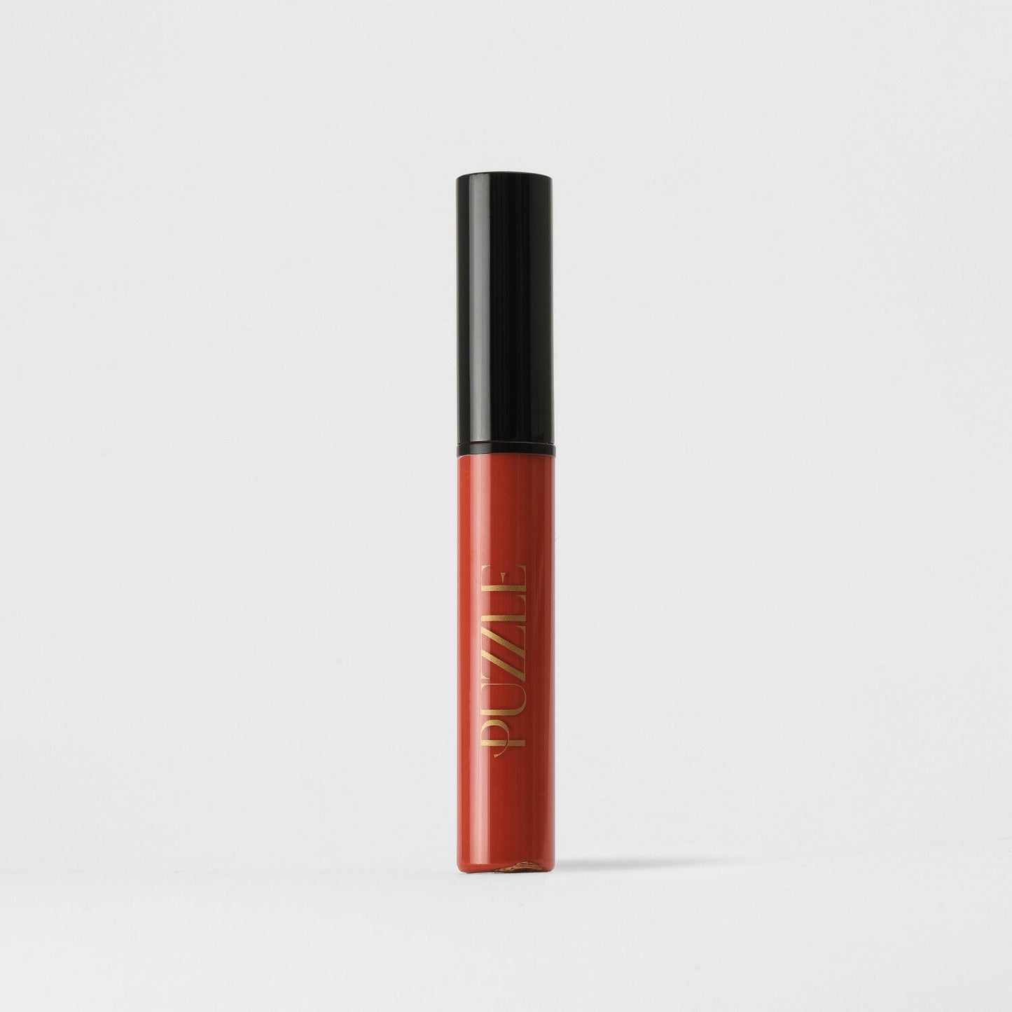 Lip Stain in sleek tube offering vegan, matte, long-lasting color and skin benefits, perfect for defining and filling lips.