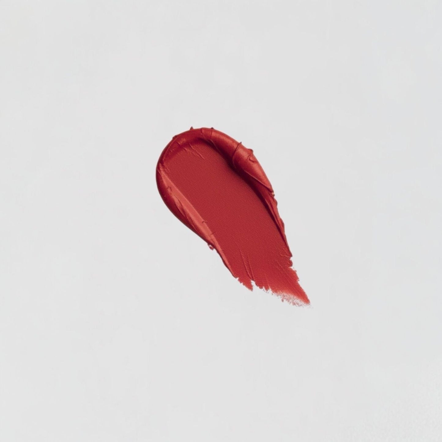 Lip Stain swatch showing velvety-soft texture and matte finish, highlighting the vegan formula's plush, long-lasting coverage.