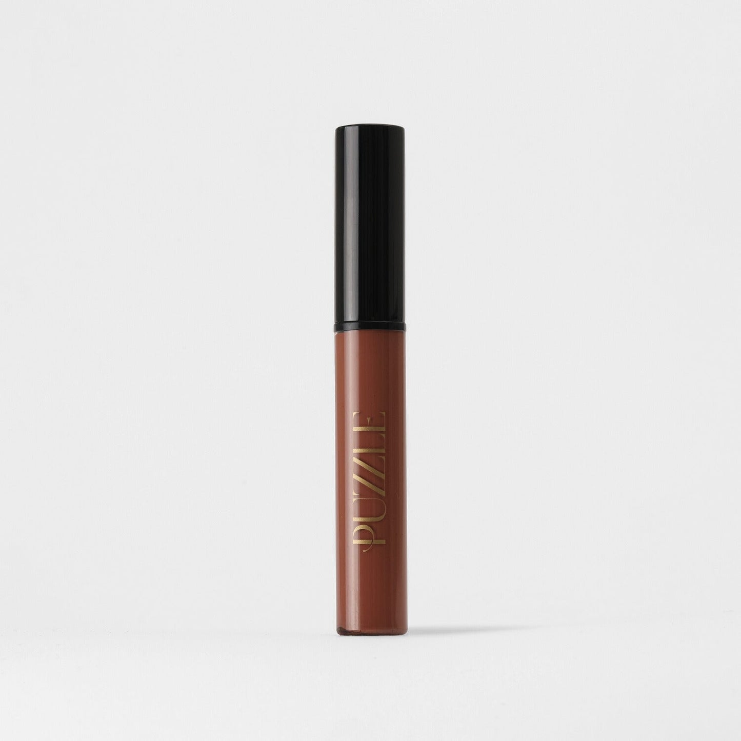 Vegan Lip Stain in brown shade with long-lasting matte finish and nourishing skin benefits, packaged in a sleek tube.