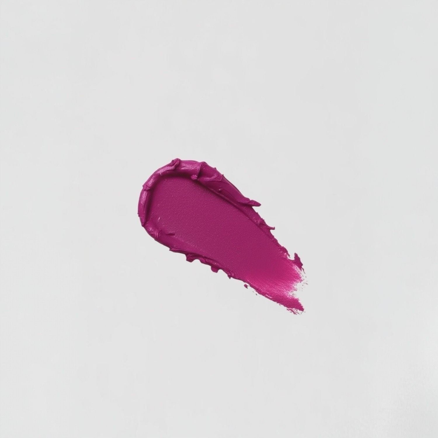 Rich pink swatch of vegan Lip Stain showcasing matte, velvety-soft texture with lasting coverage.