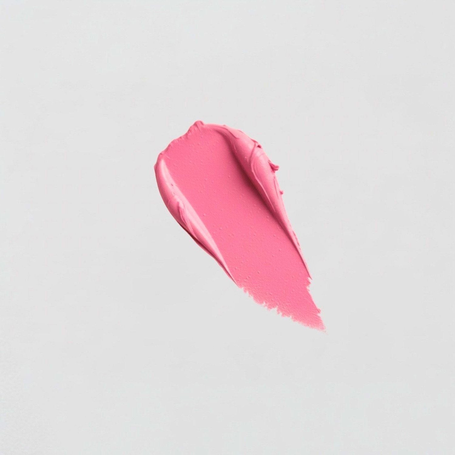 Close-up of pink Lip Stain swatch showing velvety-soft, matte texture suitable for vegan skincare.
