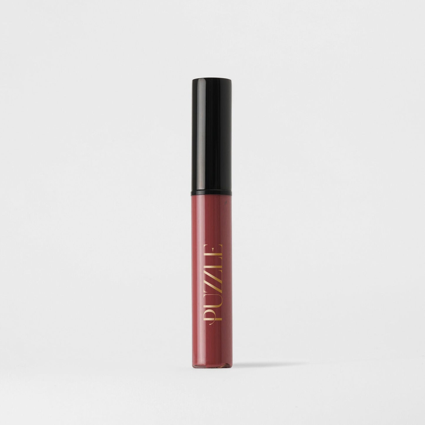 Lip Stain in elegant packaging, vegan and velvety-soft, providing matte coverage with skin benefits, showcasing serious staying power.