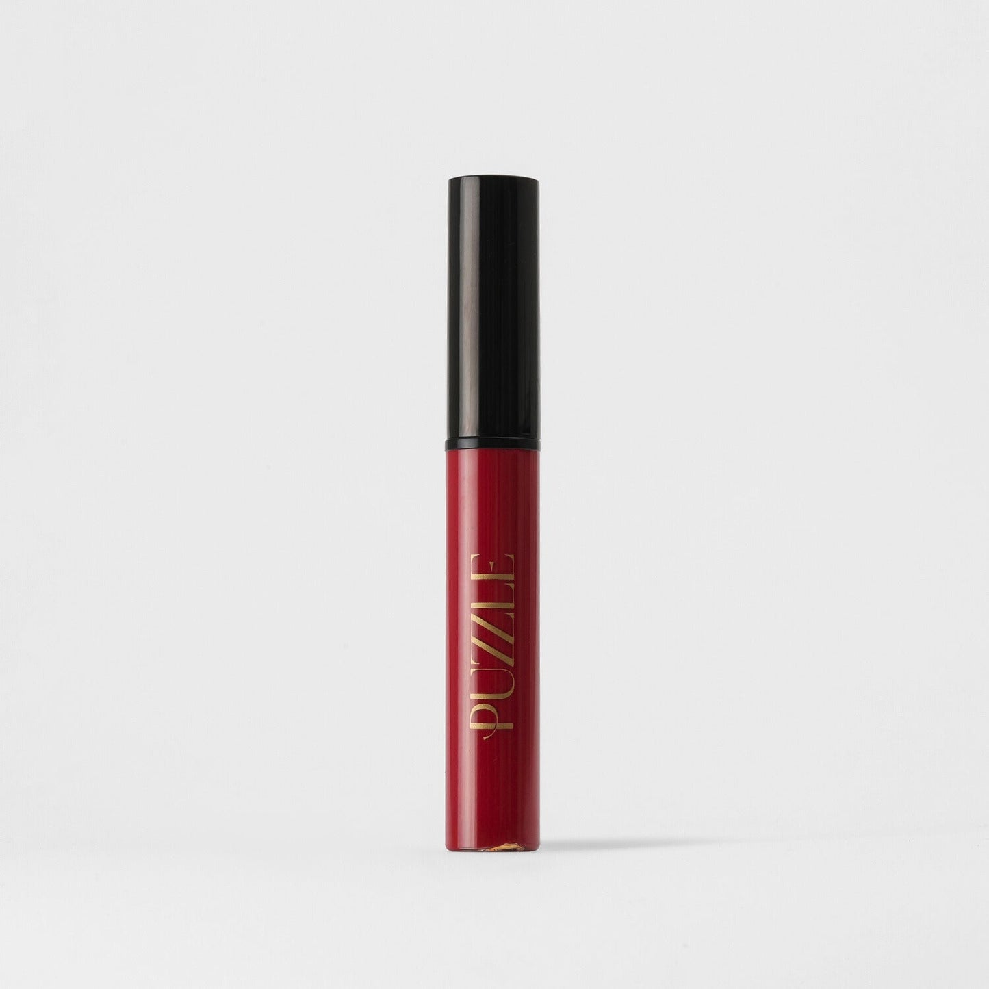 Red Lip Stain in sleek tube providing vegan, matte, long-lasting coverage.