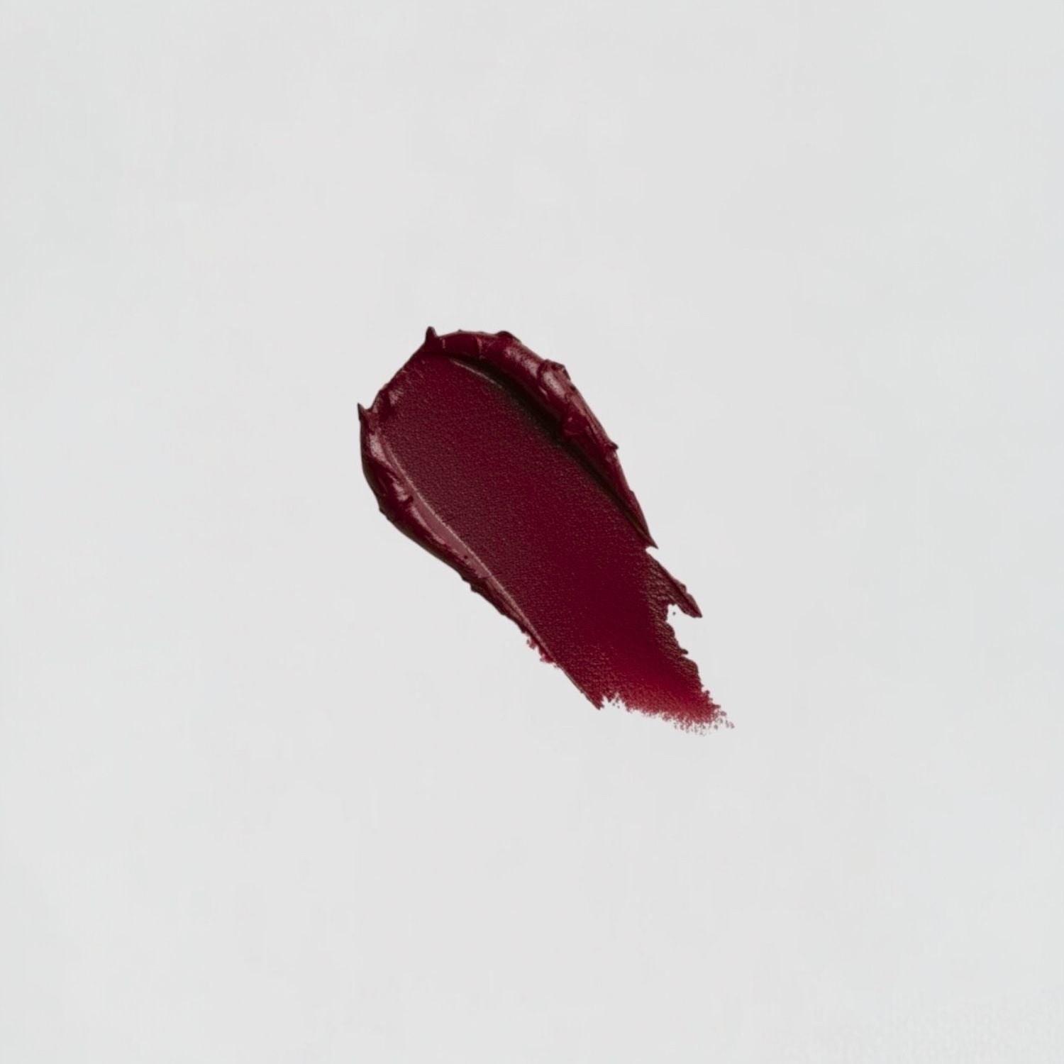 Lip Stain swatch demonstrating rich, velvety-soft texture and deep matte color ideal for long-lasting wear.