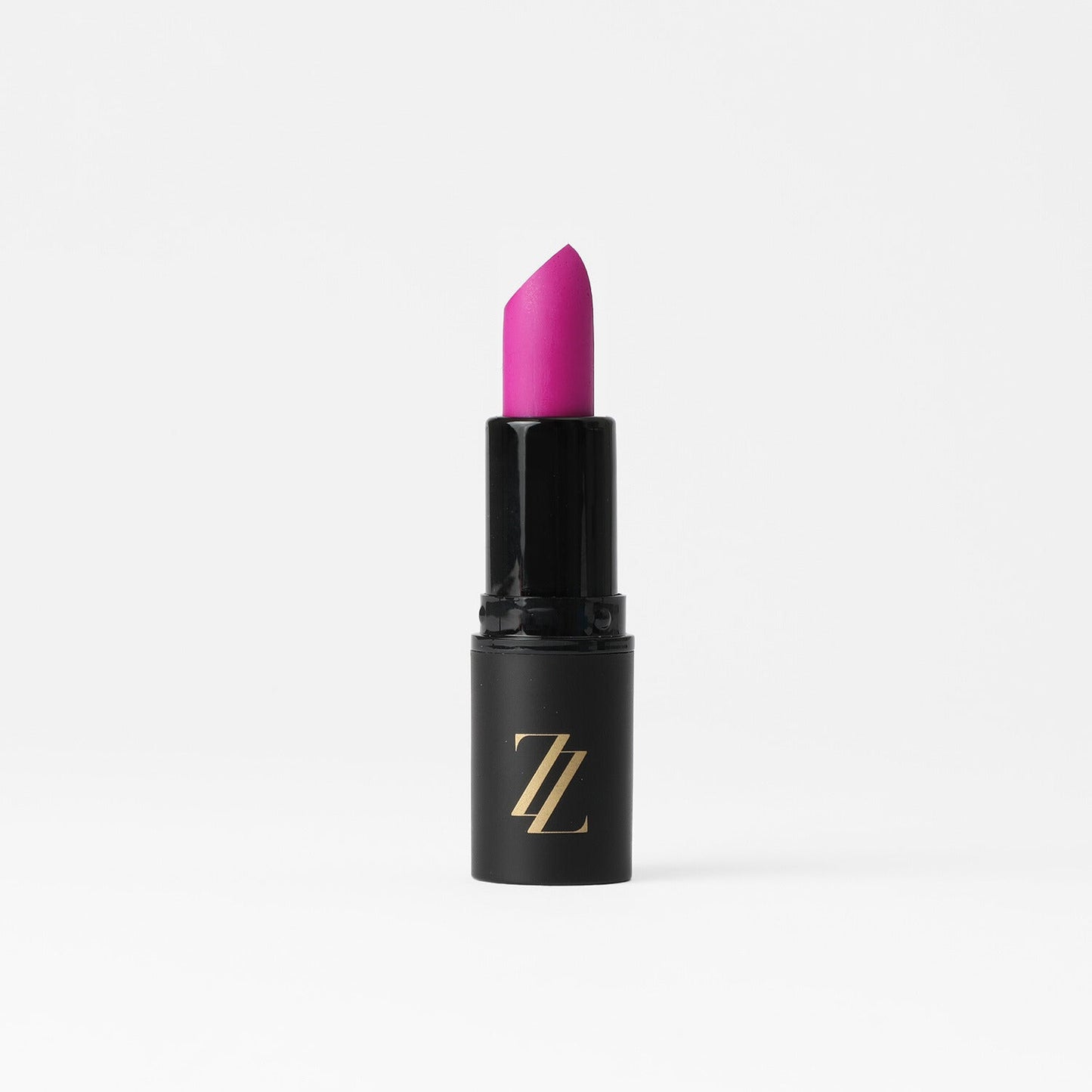 Satin Lipstick in vibrant pink shade with creamy, vegan formula, offering full coverage and lasting satin sheen finish.