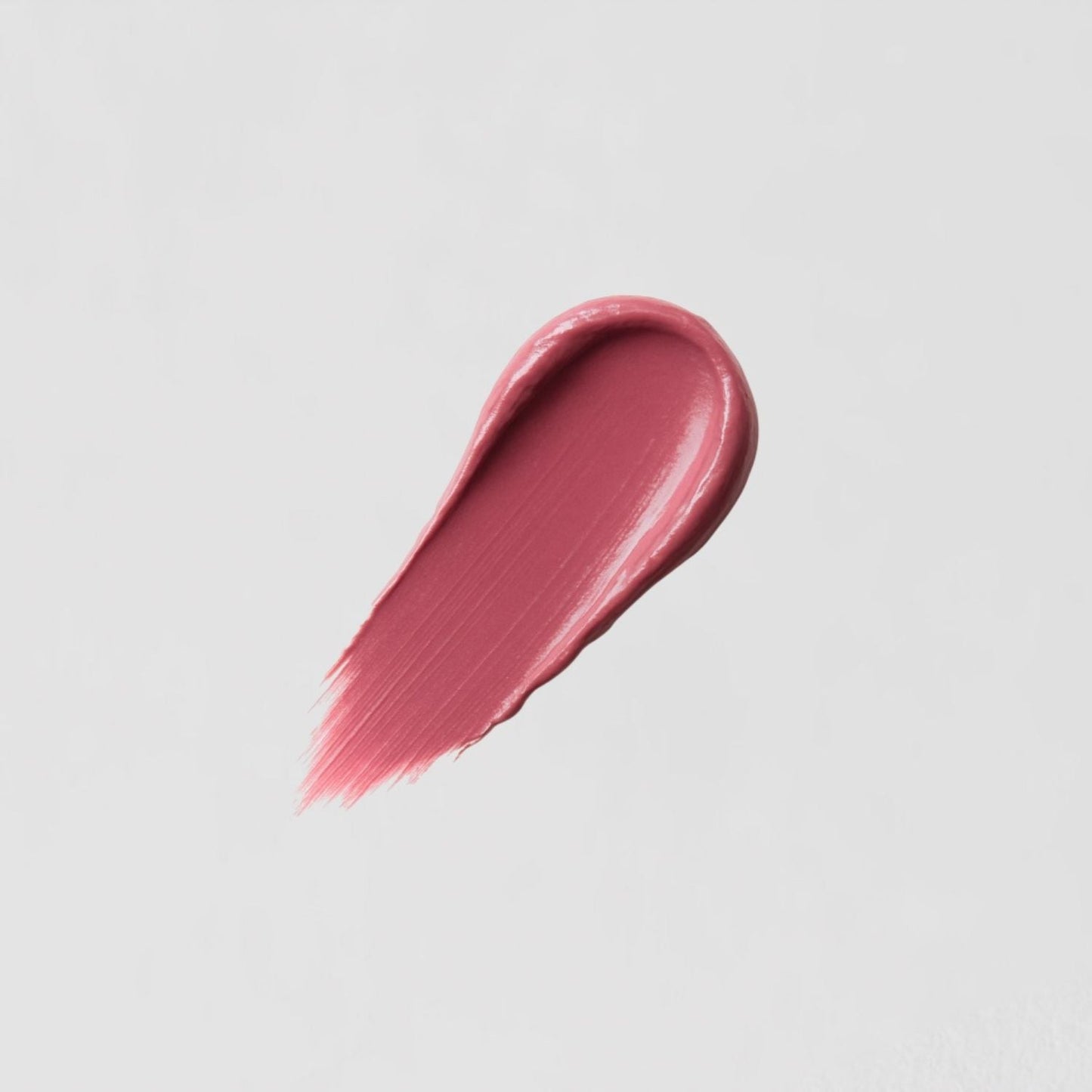 Satin Lipstick swatch showing creamy, vegan formula and full-coverage pink color with a satin sheen for a lustrous finish.