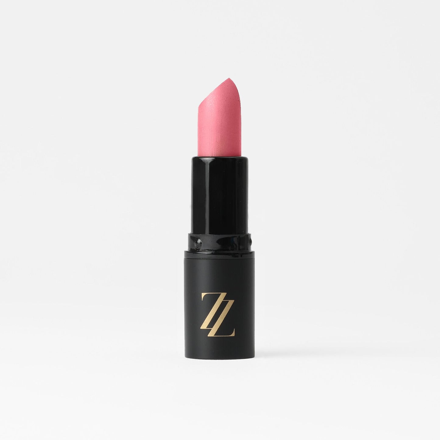 Satin Lipstick in black tube with pink creamy full-coverage color and satin sheen, vegan formula for moisture and comfort.