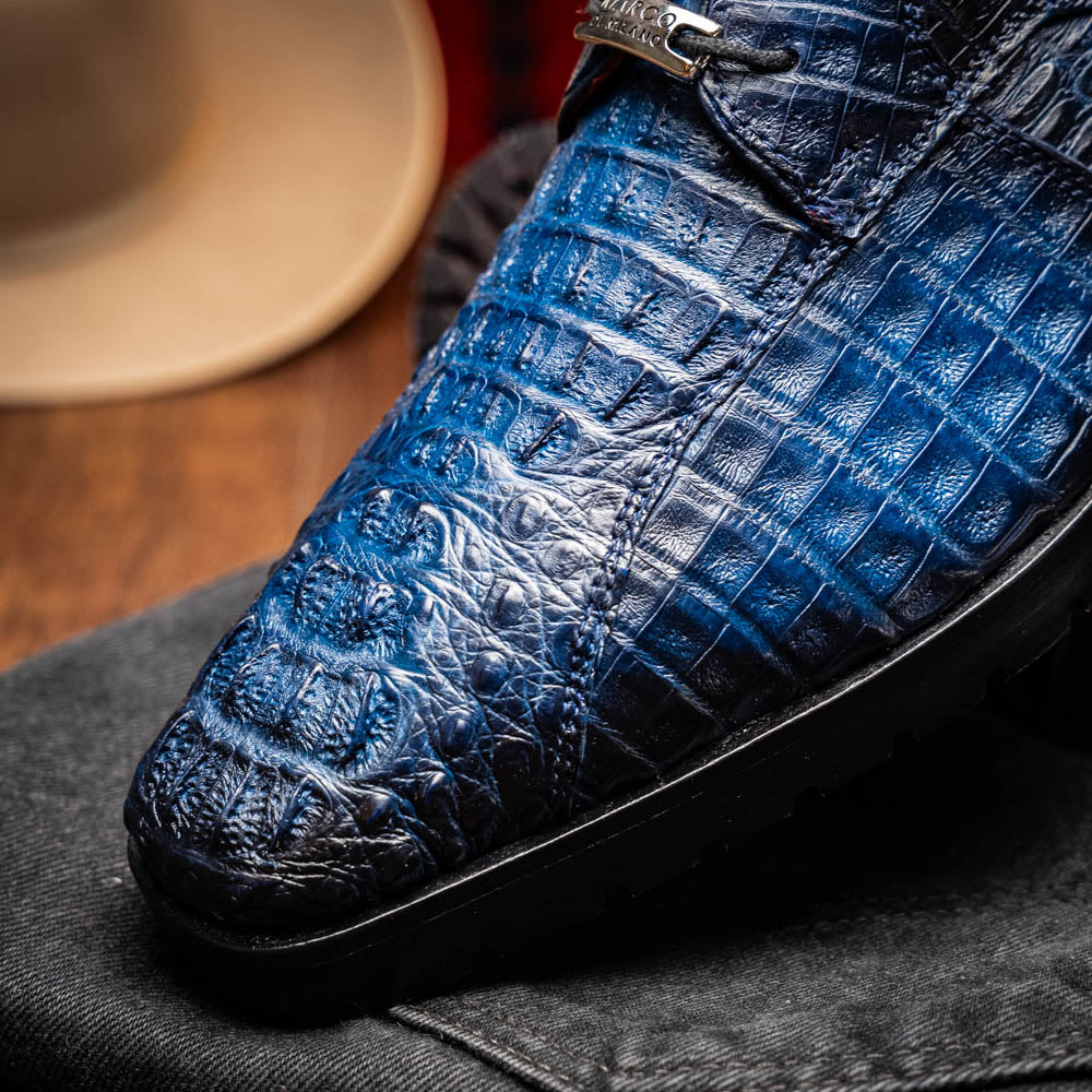 Ragusa Stained Navy Derby Shoe in genuine caiman skin with hybrid sole on display, showcasing detailed craftsmanship and bold design.