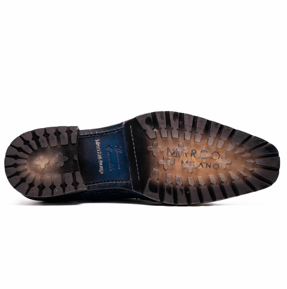 Sole of Ragusa Stained Navy derby shoe, genuine caiman skin with hybrid tread pattern.