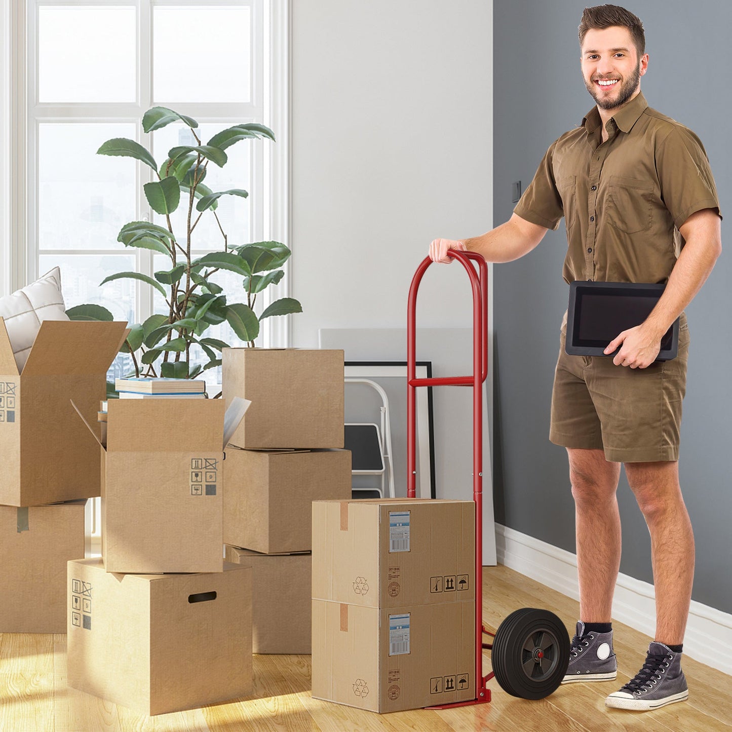 P-Handle Sack Truck with 10 Inch Wheels and Foldable Load Area-Red used for moving boxes in a living room setting