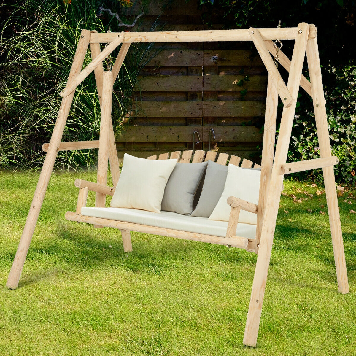 Outdoor Wooden Porch Bench Swing Chair with Rustic Curved Back on green lawn, featuring a sturdy fir wood frame and comfortable seating.