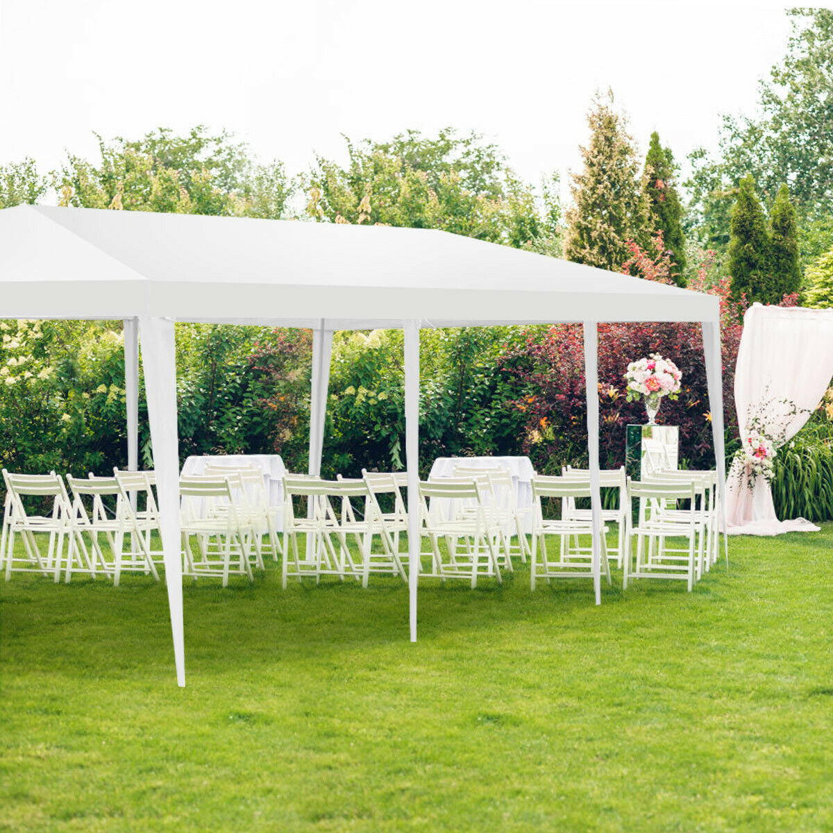 10 x 30 Feet Gazebo Canopy Tent with Connection Stakes and Wind Ropes set up in a garden with chairs