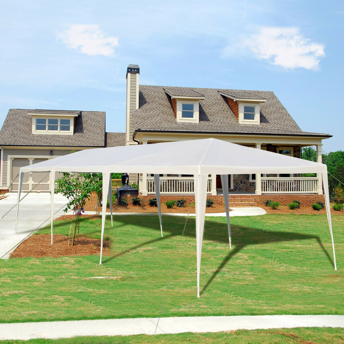 10 x 30 Feet Gazebo Canopy Tent with Connection Stakes and Wind Ropes setup in front of a house on a sunny day