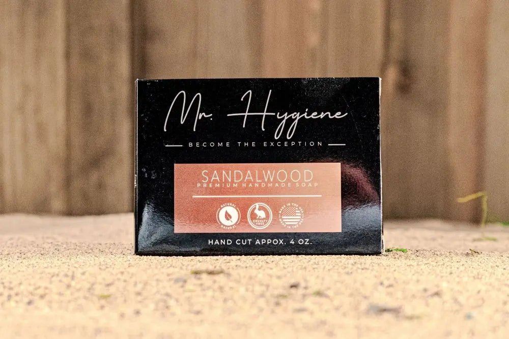 Sandalwood Bar Soap – Classic Scent, Deep Clean packaging on sandy ground.