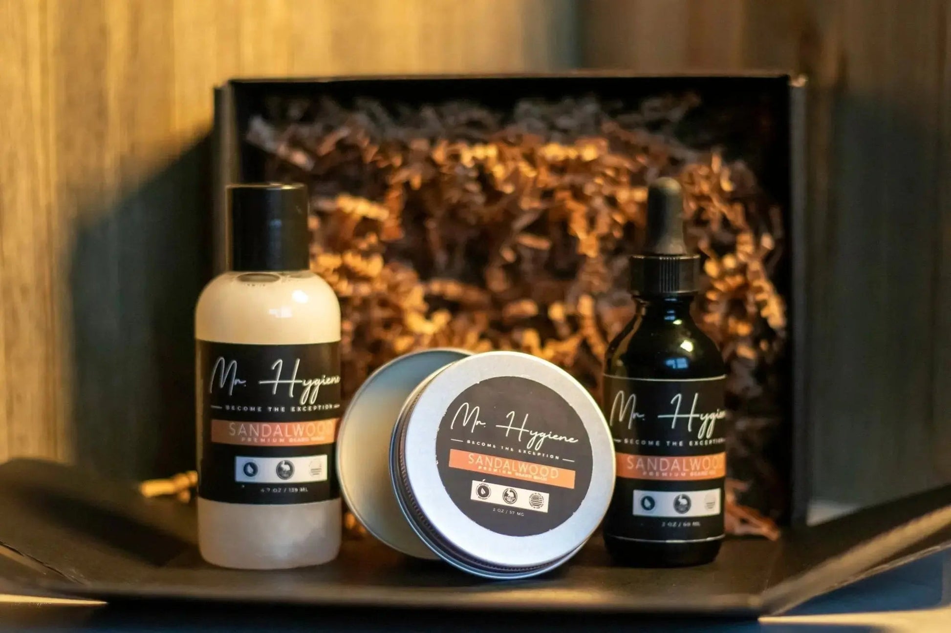 Sandalwood Beard Kit – Bold Scent, Complete Care with beard oil, balm, and wash in packaging for grooming.