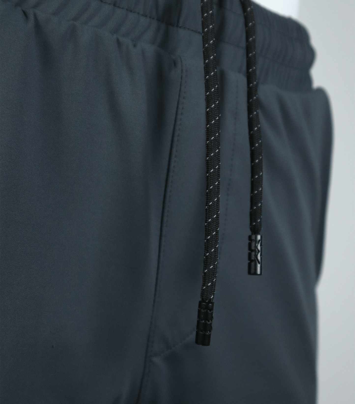 Dominate Training Shorts dark color close up sustainable Rpet Poly fabric detail