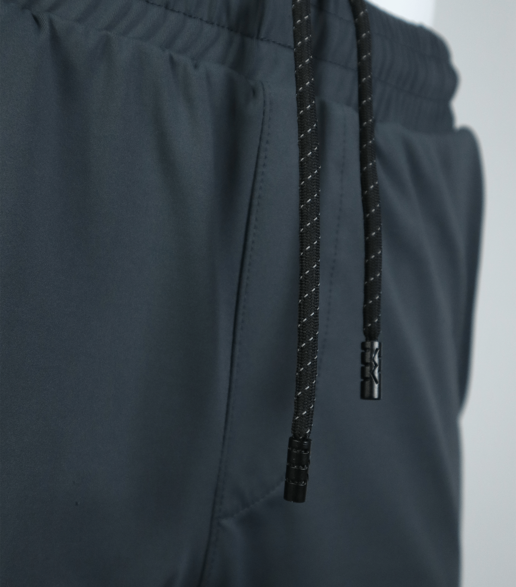 Dominate Training Shorts dark color close up sustainable Rpet Poly fabric detail
