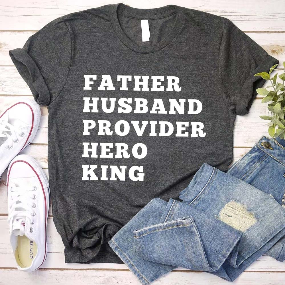 Father Husband Provider Hero King T-shirt with jeans and sneakers on wooden background.