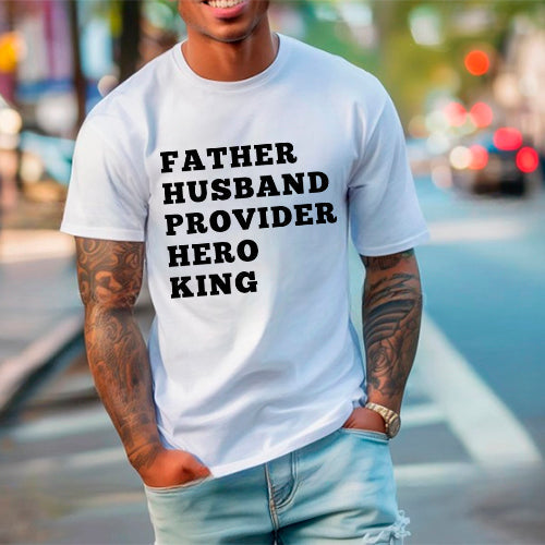 Father Husband Provider Hero King T-shirt worn by a man standing on a city street, celebrating fatherhood with pride and style.