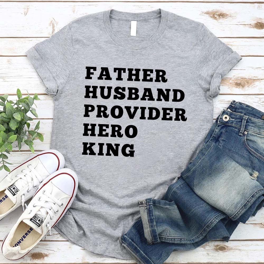 Father Husband Provider Hero King T-shirt displayed with jeans and sneakers, perfect for celebrating the role of a dedicated father.