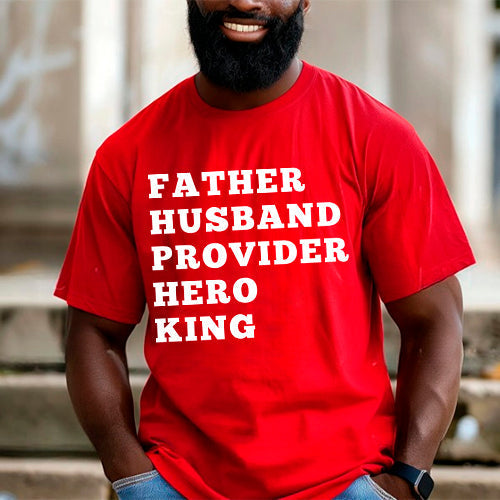 Man wearing a red Father Husband Provider Hero King T-shirt showcasing bold white lettering.