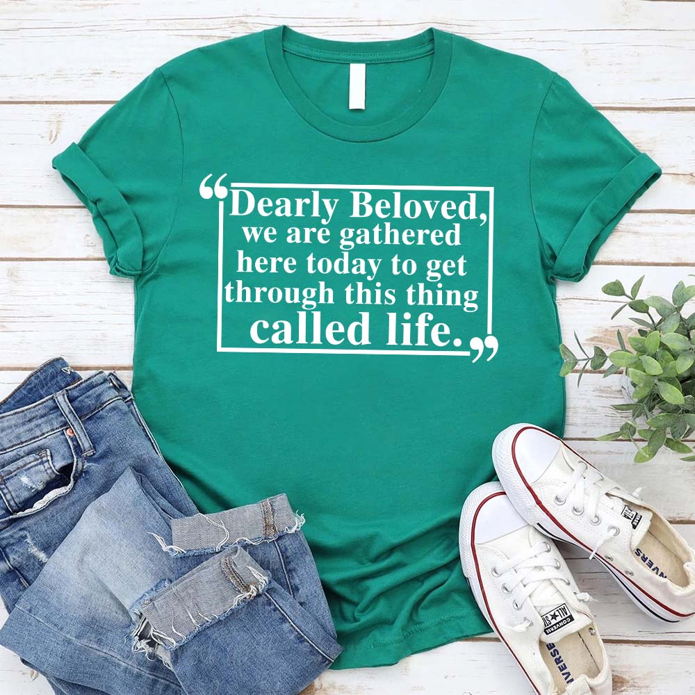"Dearly Beloved Tee Unisex Funny Quote Shirt" in green with a life quote, displayed with jeans and sneakers, promoting casual style.